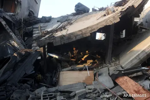 Palestinians search the debris of a destroyed home following an Israeli air strike in Gaza City, on November 19, 2012. Israeli air strikes on Sunday killed 31 Palestinians in the bloodiest day so far of its air campaign...