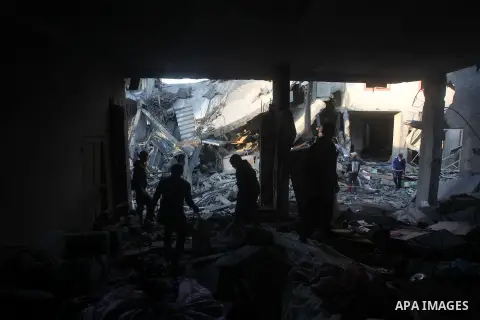 Palestinians search the debris of a destroyed home following an Israeli air strike in Gaza City, on November 19, 2012. Israeli air strikes on Sunday killed 31 Palestinians in the bloodiest day so far of its air campaign...