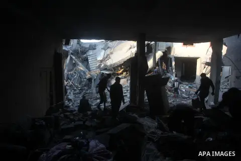 Palestinians search the debris of a destroyed home following an Israeli air strike in Gaza City, on November 19, 2012. Israeli air strikes on Sunday killed 31 Palestinians in the bloodiest day so far of its air campaign...