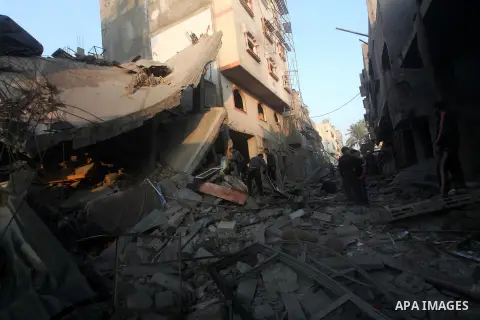 Palestinians search the debris of a destroyed home following an Israeli air strike in Gaza City, on November 19, 2012. Israeli air strikes on Sunday killed 31 Palestinians in the bloodiest day so far of its air campaign...