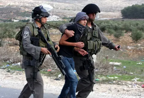 Israeli soldiers arrest a Palestinian protester during clashes following a protest against Israel's operations in the Gaza Strip, at Howwara checkpoint near Nablus, the West Bank, 17 November 2012. Reports state that the...