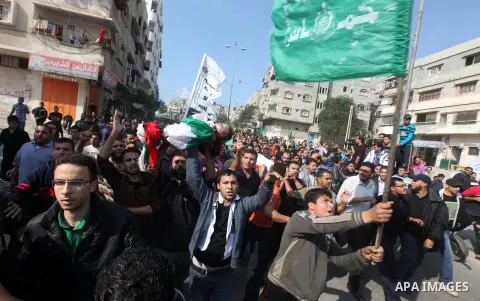 Palestinians carry the bodies of the al-Dallu family during their funeral in Gaza City, 19 November 2012. Nine members of the al-Dallu family died when Israeli forced hit their building in Gaza City one day ago. Media re...