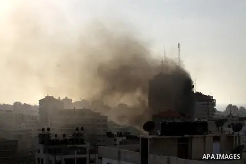 Smoke rises from al-Shorooq building which targeted by Israeli airstrike in Gaza city, 19 November, 2012. Media reports that Israeli forces were on Monday targeting the Palestinian homes and other buildings in its bombar...