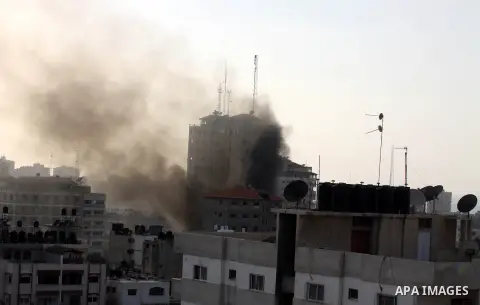 Smoke rises from al-Shorooq building which targeted by Israeli airstrike in Gaza city, 19 November, 2012. Media reports that Israeli forces were on Monday targeting the Palestinian homes and other buildings in its bombar...