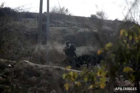 Israeli soldiers fire tear gas at Palestinian protesters during protest against burning mosques in the West Bank city of Nablus, 19 November 2012. Jewish settlers Monday set fire to al-Ribat mosque in Orif village, burni...