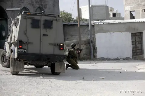 Israeli soldiers fire tear gas at Palestinian protesters during protest against burning mosques in the West Bank city of Nablus, 19 November 2012. Jewish settlers Monday set fire to al-Ribat mosque in Orif village, burni...