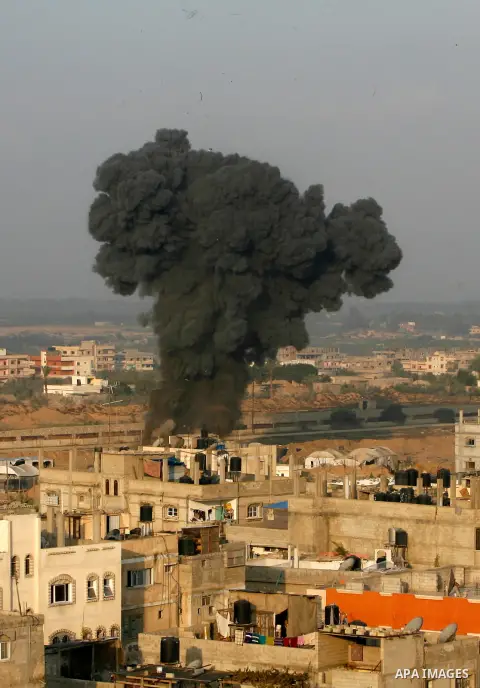 Smoke rises after an Israeli airstrike in Rafah in southern Gaza strip, 19 November, 2012. Media reports that Israeli forces were on Monday targeting the Palestinian homes and other buildings in its bombardment of the Ga...