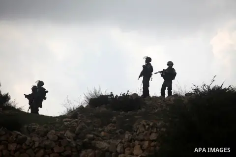 Israeli soldiers stand gaurds during minor clashes against Israel's military operation in the Gaza Strip, in the West Bank village of Birzeit, near Ramallah November 19, 2012. Israel bombed dozens of targets in Gaza on M...