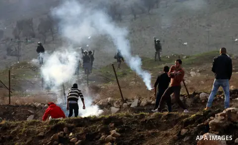 Palestinian protesters throw stones at Israeli soldiers during clashes against Israel's military operation in the Gaza Strip, in the West Bank city of Nablus on November 19, 2012. Israeli air strikes killed 22 Palestinia...