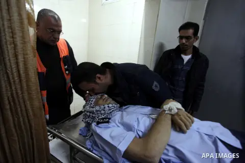 A Palestinian police man kisses the body of a 28-year-old Palestinian Rushdi Tamimi who died of his injuries sustained two days ago, in the West Bank city of Ramallah. Tamimi died on Monday after he was wounded in clashe...