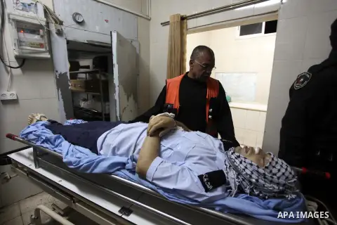 Palestinians mourn over the body of a 28-year-old Palestinian Rushdi Tamimi who died of his injuries sustained two days ago, in the West Bank city of Ramallah. Tamimi died on Monday after he was wounded in clashes with I...