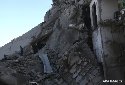 Palestinian boys salvage baggage from a building destroyed by an Israeli airstrike, in Gaza City, Gaza Strip, 20 November 2012. Media reports state that Israel pounded more than 100 targets in Gaza on the seventh day of...