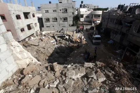 Palestinians inspect the destroyed house after an Israeli air strike in the central Gaza Strip November 20, 2012. The U.N. chief called for an immediate ceasefire in the Gaza Strip on Tuesday and U.S. Secretary of State...