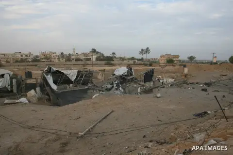 Palestinians inspect damaged tunnel following Israeli air strikes on the southern Gaza Strip town of Rafah on November 20, 2012. The Israeli military said it attacked about 100 targets in the coastal strip during the nig...