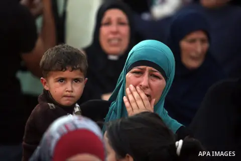 Relatives grieve Rushdi Tamimi who died of injuries sustained during clashes Saturday with Israeli security, during his funeral in the West Bank city of Ramallah, Tuesday, Nov 20, 2012. Tamimi was wounded during a protes...
