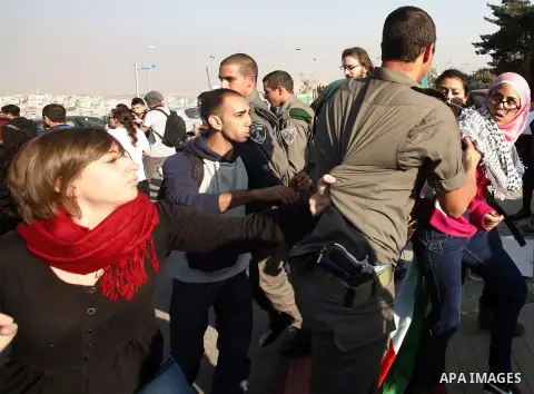 Palestinian protestors and Israelis shout slogans during a protest in Hebrew University in Jerusalem's Old City 20 November 2012, showing solidarity with the Palestinians in the Gaza Strip, as hostilities continue on the...