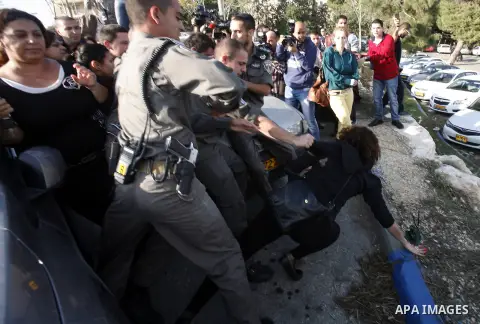 Israeli soldiers arrest a Palestinian protester during a Palestinian protest at Hebrew University in Jerusalem, 20 November 2012, showing solidarity with the Palestinians in the Gaza Strip, as hostilities continue on the...
