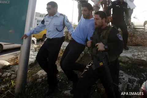 Israeli soldiers arrest a Palestinian protester during a Palestinian protest at Hebrew University in Jerusalem, 20 November 2012, showing solidarity with the Palestinians in the Gaza Strip, as hostilities continue on the...
