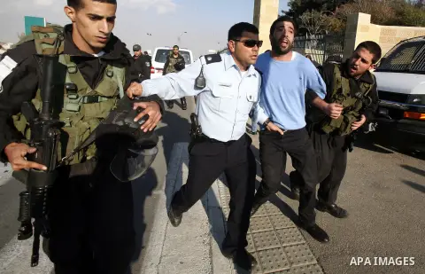 Israeli soldiers arrest a Palestinian protester during a Palestinian protest at Hebrew University in Jerusalem, 20 November 2012, showing solidarity with the Palestinians in the Gaza Strip, as hostilities continue on the...