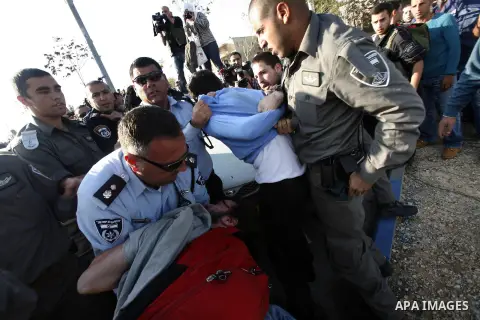 Israeli soldiers arrest a Palestinian protester during a Palestinian protest at Hebrew University in Jerusalem, 20 November 2012, showing solidarity with the Palestinians in the Gaza Strip, as hostilities continue on the...