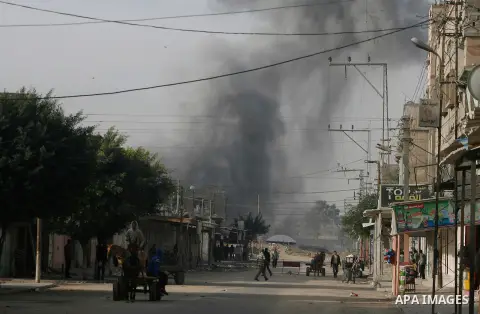 Smoke rises following an Israeli strike on smuggling tunnels along the border between Egypt and Rafah southern Gaza Strip, Wednesday, Nov. 21, 2012. Israeli aircraft pounded Gaza with at least 30 strikes overnight, hitti...