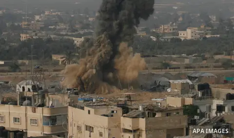 Smoke rises following an Israeli strike on smuggling tunnels along the border between Egypt and Rafah southern Gaza Strip, Wednesday, Nov. 21, 2012. Israeli aircraft pounded Gaza with at least 30 strikes overnight, hitti...