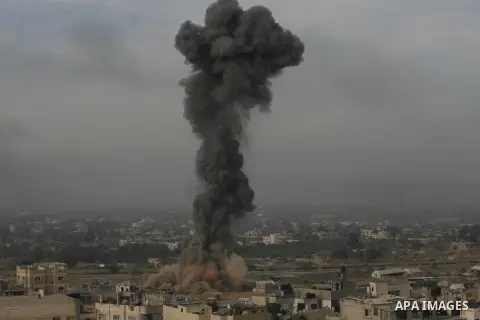 Smoke rises following an Israeli strike on smuggling tunnels along the border between Egypt and Rafah southern Gaza Strip, Wednesday, Nov. 21, 2012. Israeli aircraft pounded Gaza with at least 30 strikes overnight, hitti...