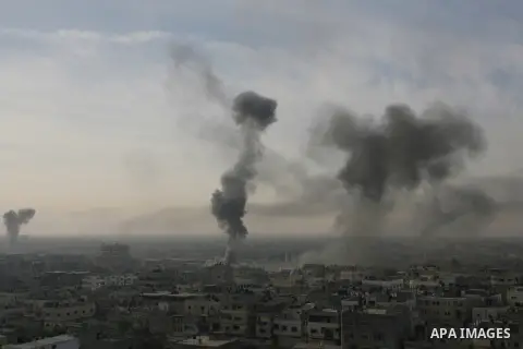 Smoke rises following an Israeli strike on smuggling tunnels along the border between Egypt and Rafah southern Gaza Strip, Wednesday, Nov. 21, 2012. Israeli aircraft pounded Gaza with at least 30 strikes overnight, hitti...
