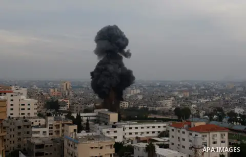 Smoke rises following an Israeli strike in Gaza city, Wednesday, Nov. 21, 2012. Israeli aircraft pounded Gaza with at least 30 strikes overnight, hitting government ministries, smuggling tunnels, a banker's empty villa a...