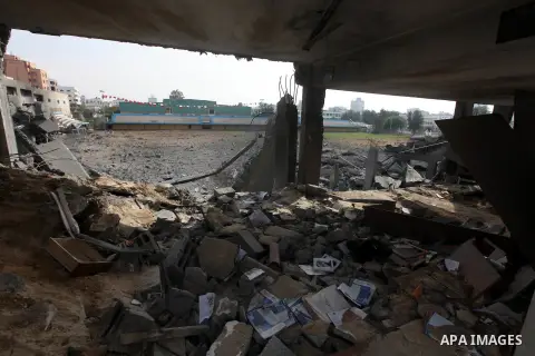 A destroyed gridiron seen after an israeli air strike in Gaza City, 21 November 2012. Palestinian militants renewed their rocket fire on Israel 21 November and Israel continued pounding targets in the Gaza Strip, as agre...