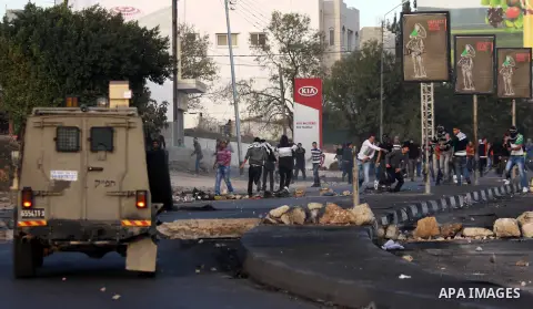 Palestinian protesters throw stones at Israeli soldiers during clashes in the West Bank city of Nablus, on November 21, 2012. The West Bank has witnessed almost daily demonstrations in support of Gaza Palestinians who ha...