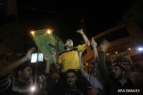 Palestinians celebrate what they say is a victory over Israel after an eight-day conflict in Gaza City, November 21, 2012. Israel and the Islamist Hamas movement agreed on Wednesday to an Egyptian-sponsored ceasefire to...