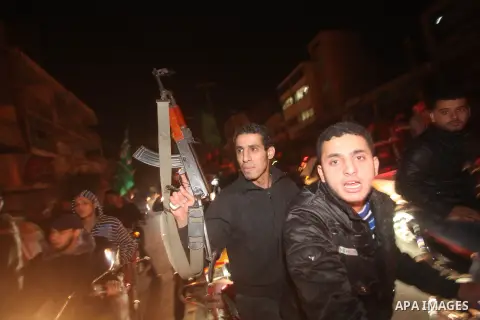 Palestinians celebrate what they say is a victory over Israel after an eight-day conflict in Gaza City, November 21, 2012. Israel and the Islamist Hamas movement agreed on Wednesday to an Egyptian-sponsored ceasefire to...