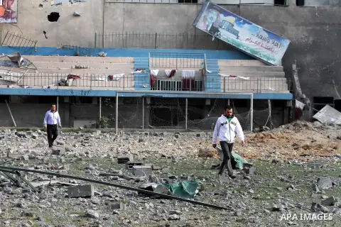 Palestinians inspect the debris of the destroyed Palestine Sports Stadium in Gaza City on November 22, 2012, after a ceasefire took hold in and around Gaza after a week of cross-border violence between Israel and Palesti...