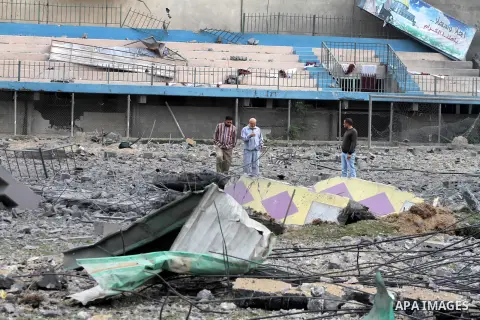 Palestinians inspect the debris of the destroyed Palestine Sports Stadium in Gaza City on November 22, 2012, after a ceasefire took hold in and around Gaza after a week of cross-border violence between Israel and Palesti...