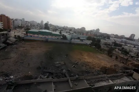 Palestinians inspect the debris of the destroyed Palestine Sports Stadium in Gaza City on November 22, 2012, after a ceasefire took hold in and around Gaza after a week of cross-border violence between Israel and Palesti...