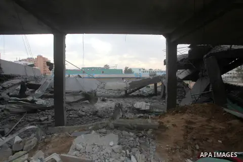 Palestinians inspect the debris of the destroyed Palestine Sports Stadium in Gaza City on November 22, 2012, after a ceasefire took hold in and around Gaza after a week of cross-border violence between Israel and Palesti...