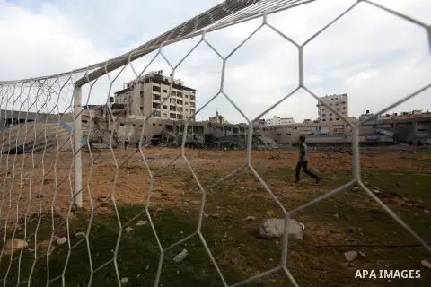 Palestinians inspect the debris of the destroyed Palestine Sports Stadium in Gaza City on November 22, 2012, after a ceasefire took hold in and around Gaza after a week of cross-border violence between Israel and Palesti...