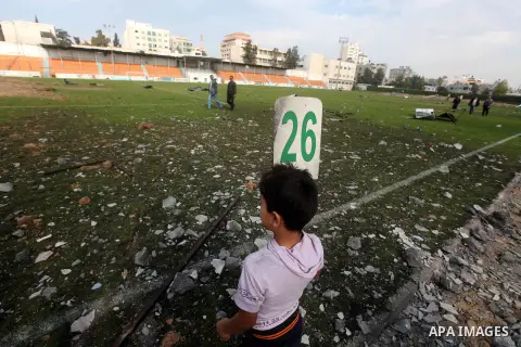 Palestinians inspect the debris of the destroyed Yarmouk Sports Stadium in Gaza City on November 22, 2012, after a ceasefire took hold in and around Gaza after a week of cross-border violence between Israel and Palestini...