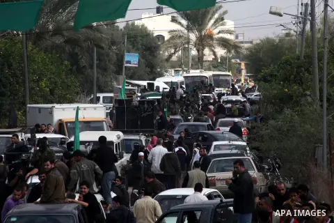 Hamas militants ride in a pick-up truck as they take part in the funeral of their comrades, whom medics said were killed in Israeli air strikes on Wednesday, in the central Gaza Strip November 22, 2012. A ceasefire betwe...