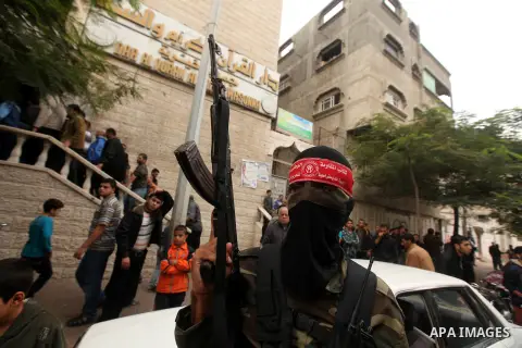 Palestinian militants from the Popular Front for the Liberation of Palestine (PFLP) attends the funeral of Mohammed Abdel-Rahman Ayesh, a militant from from the Al Nasser Brigades, an armed wing of the Popular Resistance...