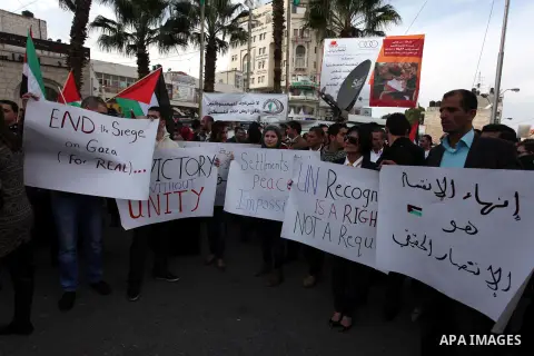 Palestinians celebrate what they call a victory over Israel, in the West Bank city of Ramallah, Nov. 22, 2012. Eight days of punishing Israeli airstrikes on Gaza and a barrage of Hamas rocket fire on Israeli ended inconc...