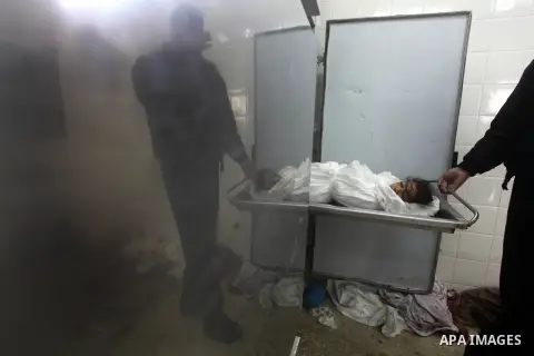 A man holds the body of his daughter, three-year-old Reham Al Nabaheen, during her funeral at Al Nusairat refugee camp in central Gaza Strip, 22 November 2012. Reham Al Nabaheen was reportedly killed after an Israeli air...