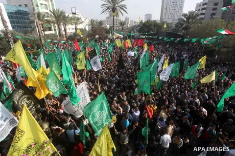 Palestinians gather to celebrate and listen to Palestinian prime minister in the Gaza Strip Ismail Haniya delivering a speech in Gaza City on November 22, 2012. The ruling Hamas movement declared the day to be a public h...