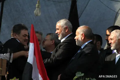 Palestinian prime minister in Gaza Ismail Haniyeh and Islamic Jihad leader Mohammed Al-Hindi, senior Fatah official Nabil Shaath and deputy speaker of Palestinian Parliament Ahmed Bahar celebrate what Palestinians say is...