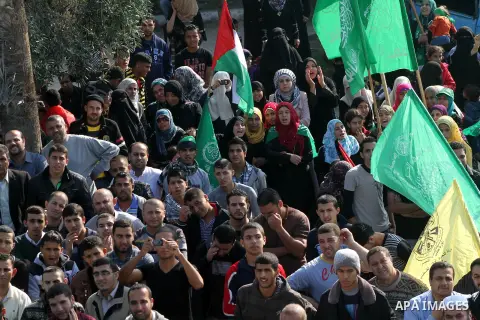 Palestinians gather to celebrate and listen to Palestinian prime minister in the Gaza Strip Ismail Haniya delivering a speech in Gaza City on November 22, 2012. The ruling Hamas movement declared the day to be a public h...