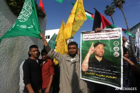 Palestinians gather to celebrate and listen to Palestinian prime minister in the Gaza Strip Ismail Haniya delivering a speech in Gaza City on November 22, 2012. The ruling Hamas movement declared the day to be a public h...