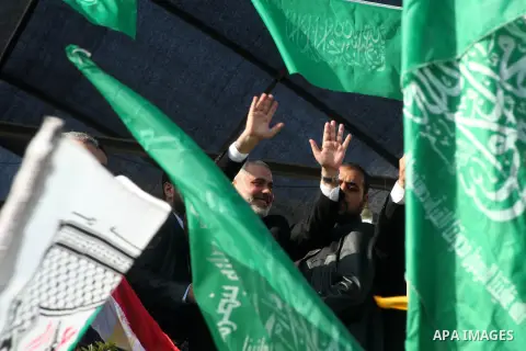 Palestinian prime minister in Gaza Ismail Haniyeh and Islamic Jihad leader Mohammed Al-Hindi, senior Fatah official Nabil Shaath and deputy speaker of Palestinian Parliament Ahmed Bahar celebrate what Palestinians say is...