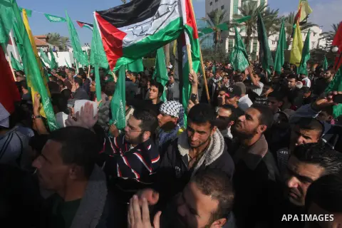 Palestinians gather to celebrate and listen to Palestinian prime minister in the Gaza Strip Ismail Haniya delivering a speech in Gaza City on November 22, 2012. The ruling Hamas movement declared the day to be a public h...