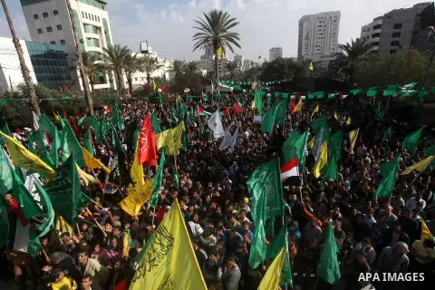 Palestinians gather to celebrate and listen to Palestinian prime minister in the Gaza Strip Ismail Haniya delivering a speech in Gaza City on November 22, 2012. The ruling Hamas movement declared the day to be a public h...